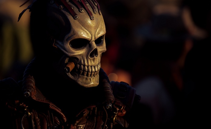 Man in skull mask with cigar