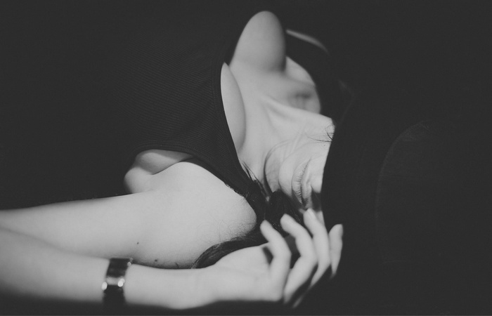 Monochrome portrait of a woman wearing a hat