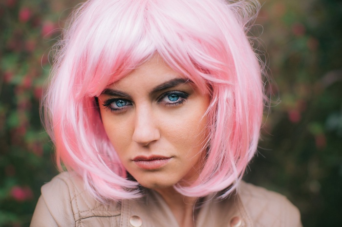 Woman with pink wig and blue eyes