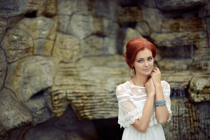 Aleksandra Korzhavina in a white dress outdoors