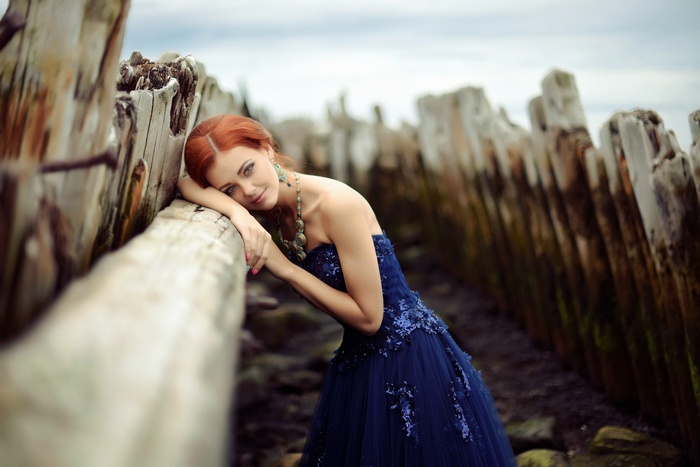 Aleksandra Korzhavina in a blue dress outdoors