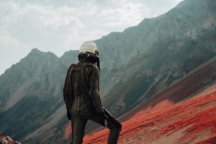 David Schermann photography of a person in a pressure suit in mountains