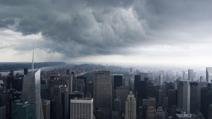 New York City skyline under stormy clouds