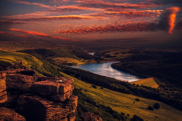 River landscape at sunset with dramatic clouds