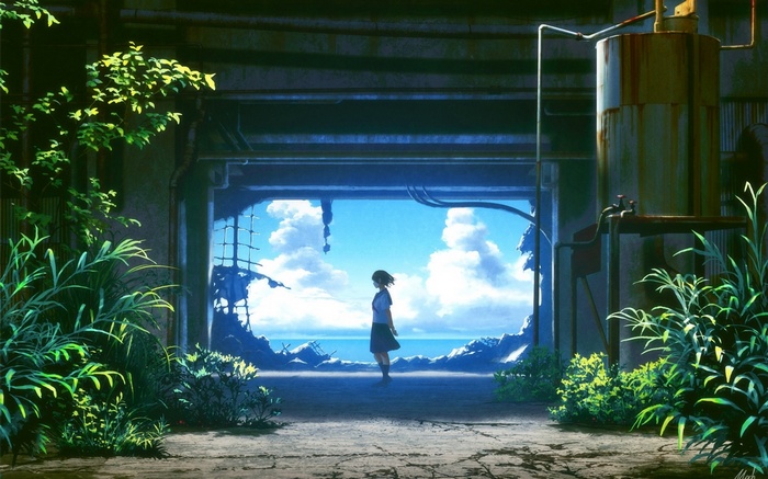 Girl in school uniform stands in ruins overlooking the sea