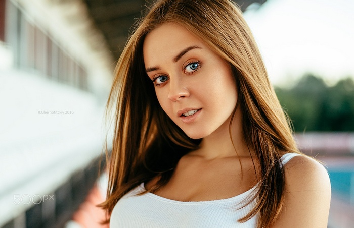 Portrait of a Woman with Blue Eyes by Roma Chernotitckiy