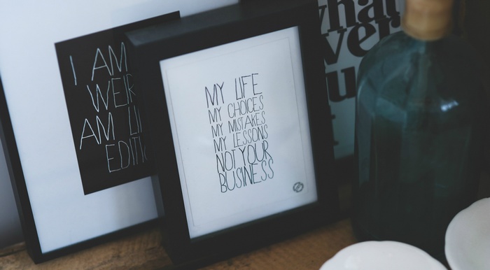 Framed quotes on a shelf