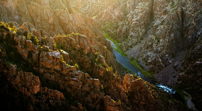 River flowing through a rocky canyon at sunset