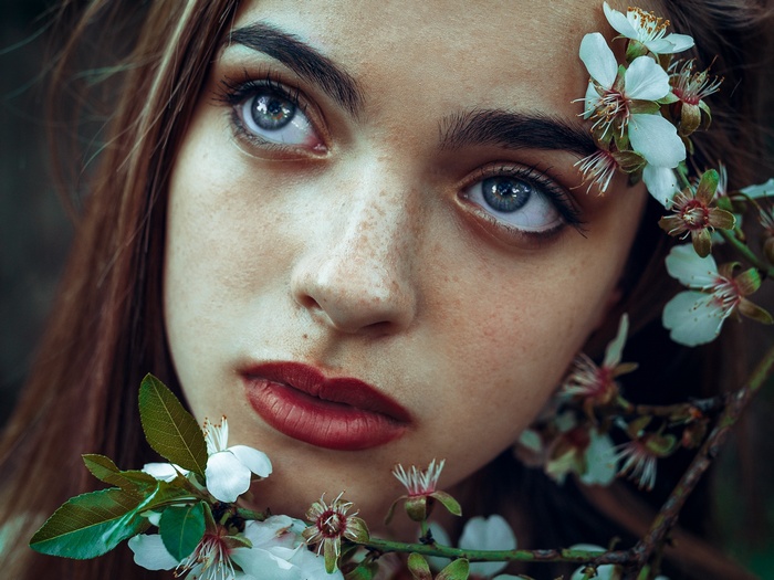 Surabhi Gupta with flowers and red lipstick