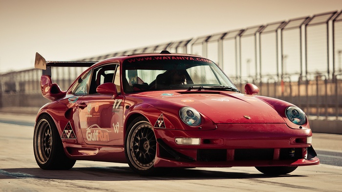 Red Porsche 993 GT2 race car on a track