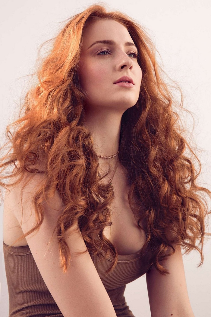 Sophie Turner with long curly red hair