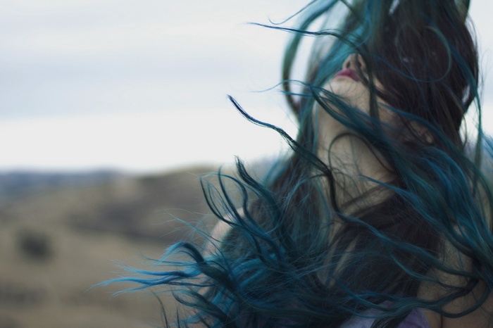 Woman with blue hair outdoors