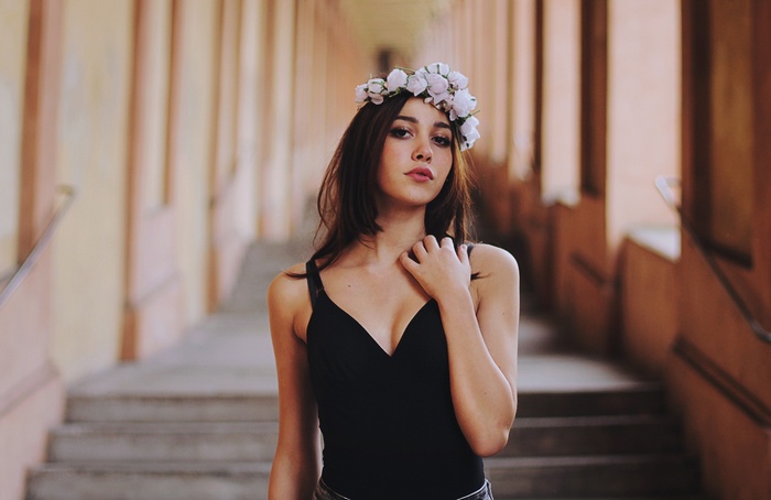 Woman with flower crown and black top