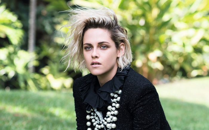 Kristen Stewart in a black Chanel jacket with pearls