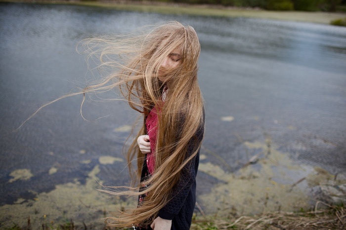 Woman with long hair by the water
