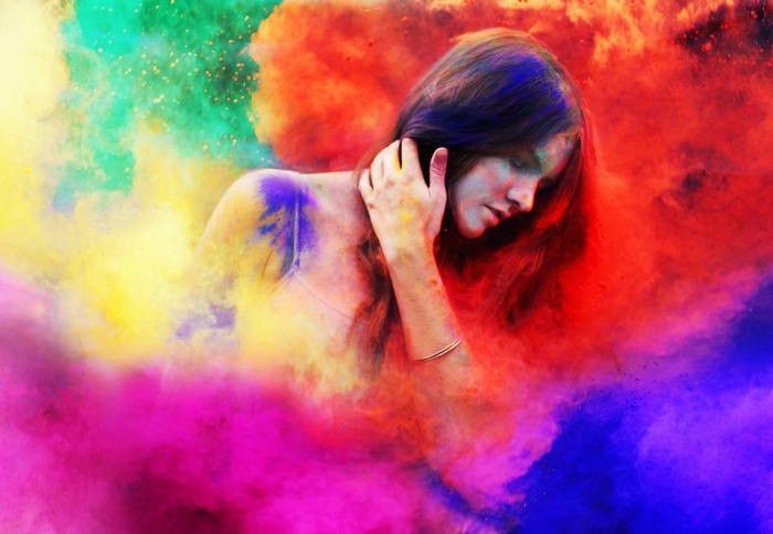 Woman covered in colorful powder during Holi festival