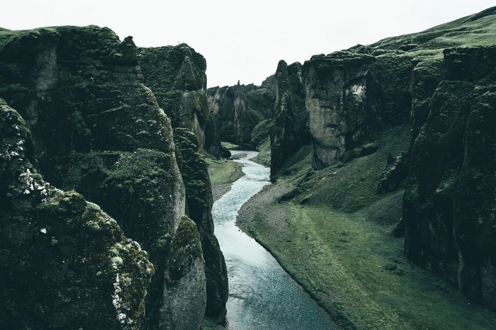 River flowing through a moss-covered canyon