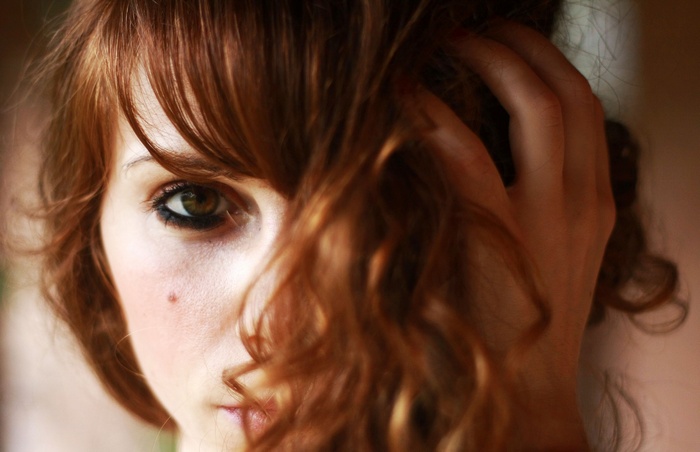 Woman with red hair and brown eyes