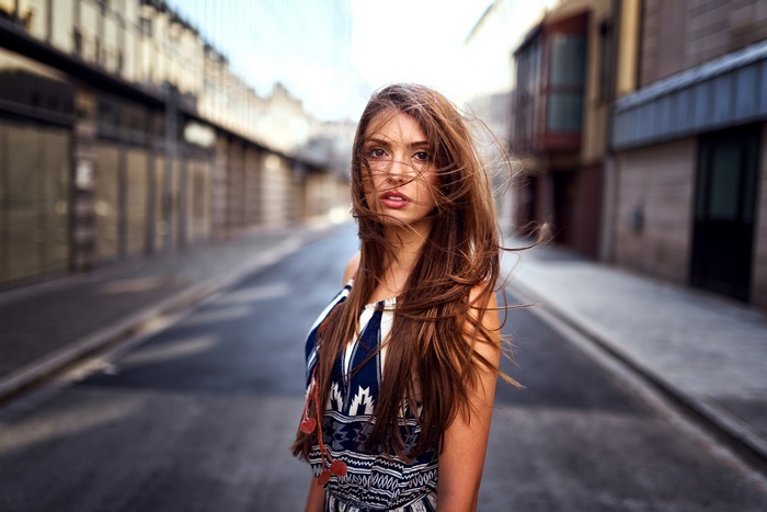 Miro Hofmann portrait of a woman with long hair on a street
