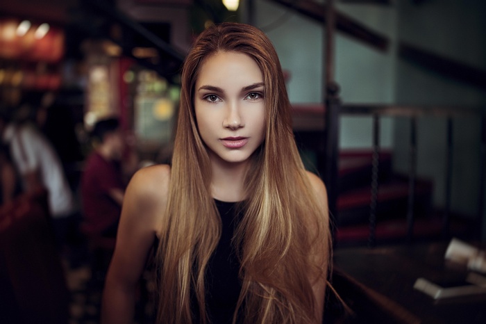 Portrait of a young woman with long blonde hair