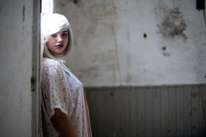 Woman with blonde hair and lace top