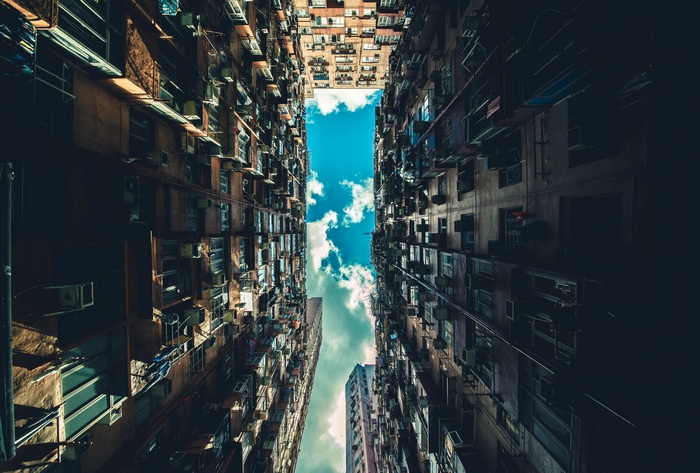 View of apartment buildings looking up at the sky