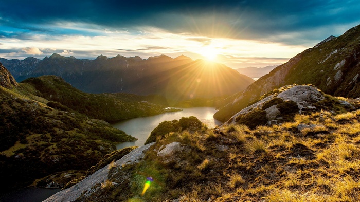 Sunset over mountains and a lake