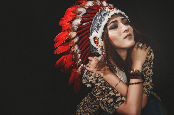 Woman wearing a Native American headdress