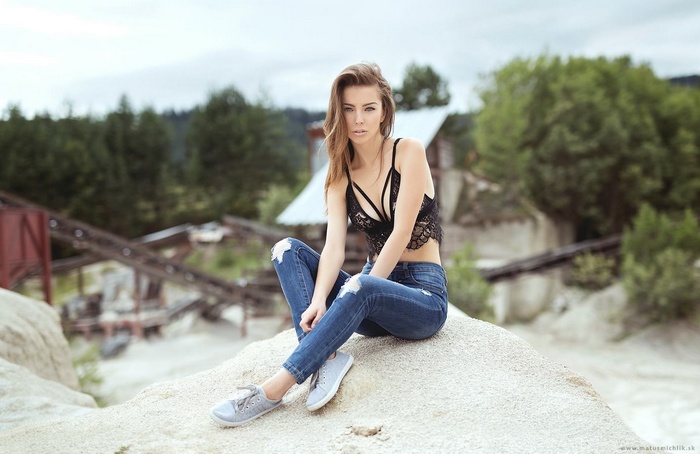Woman in lace top and jeans by Matus Michlik
