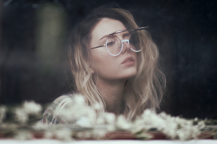 Ruby James with glasses and blonde wavy hair