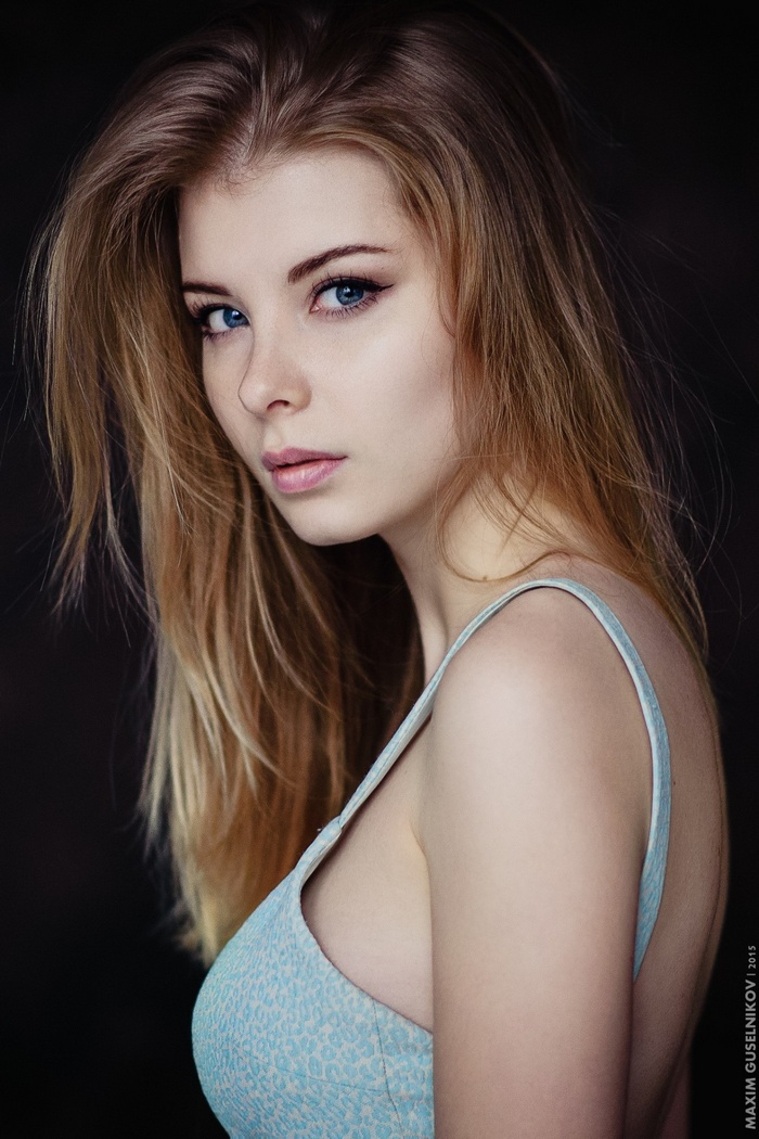 Portrait of a blonde woman with blue eyes by Maxim Guselnikov