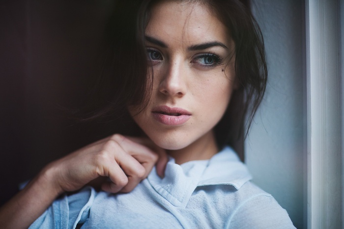Ruby James looking out a window