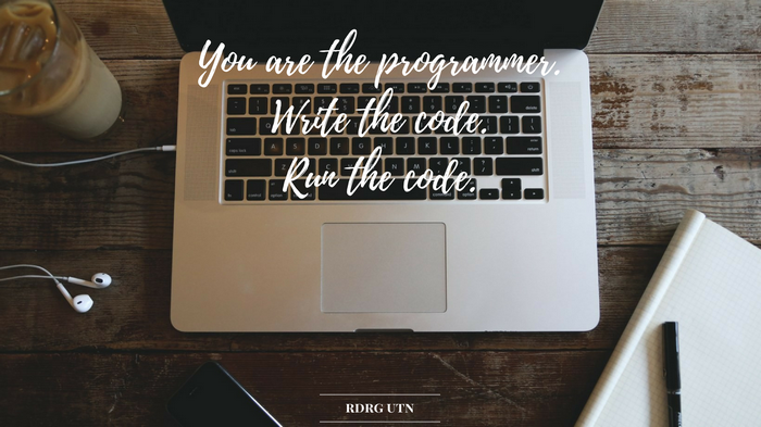 MacBook with motivational quote about programming
