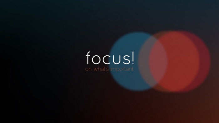 Motivational quote "focus on what's important" with bokeh effect