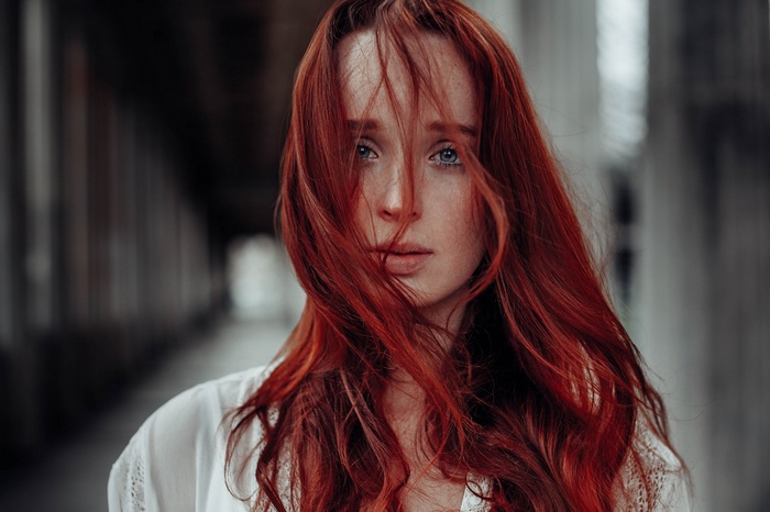 Anne Hoffmann with red hair and blue eyes