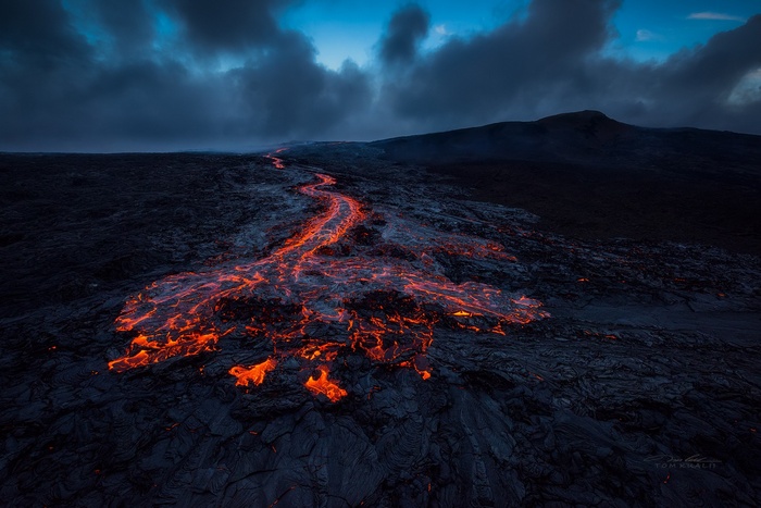 Lava flow from a volcano in Hawaii by Tom Kualii