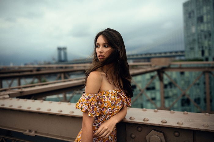 Model Jesse Herzog on a bridge in the wind