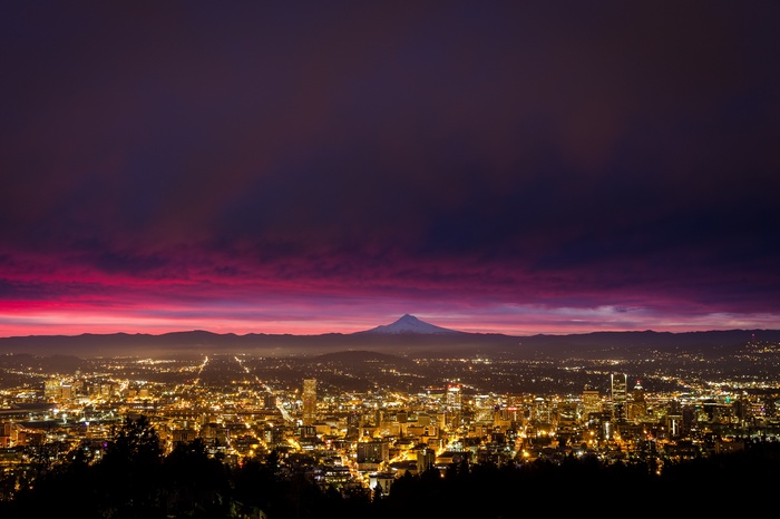Cityscape at dusk with Mount Hood in the distance
