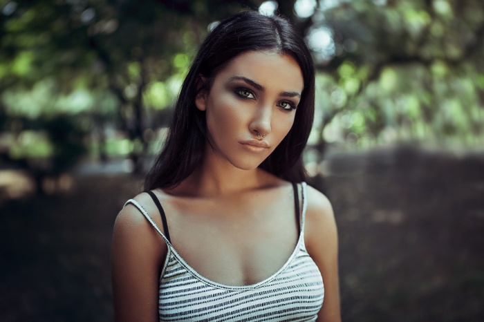 Woman with nose ring in a tank top