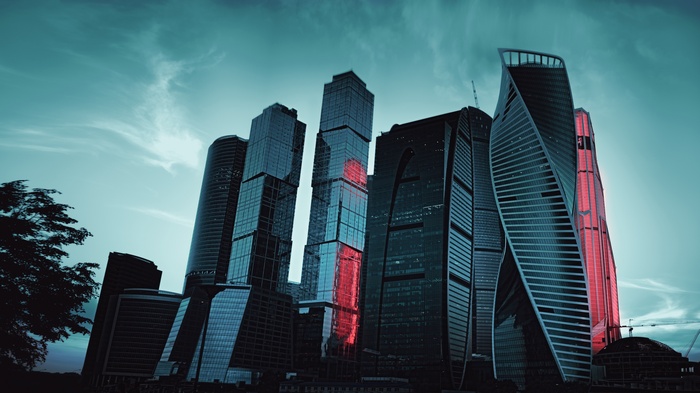 Moscow City skyscrapers at dusk with red lighting