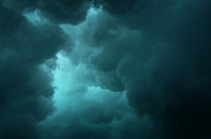 Dark teal clouds with bright turquoise light
