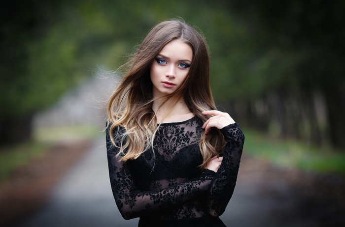 Portrait of a woman with blue eyes and long hair