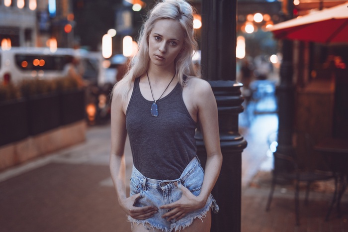 Hayley Davis wearing jean shorts and a tank top