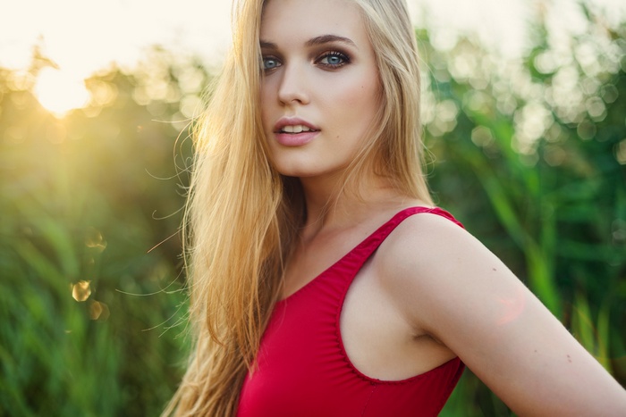 Olga Kryvoshei in red swimsuit outdoors