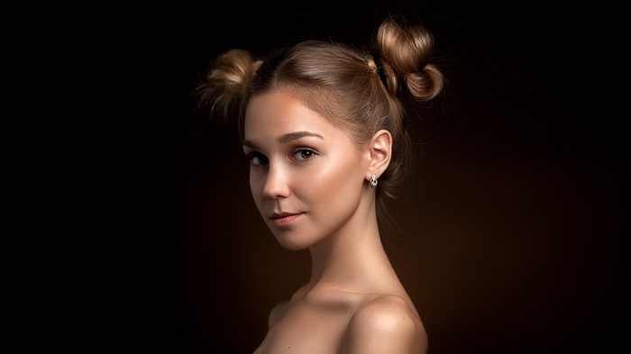 Portrait of a young woman with buns