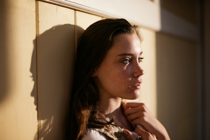 Woman with shadow on wall