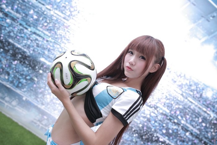 Ji Xin Qiao, portrait, women, looking at viewer, long hair, auburn hair, brown eyes, soccer ball, Asian, pigtails