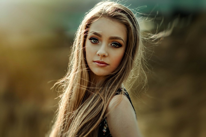 Portrait of a young blonde woman with makeup