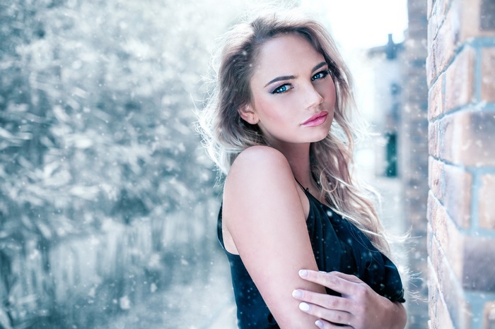 Woman with blonde hair in the snow
