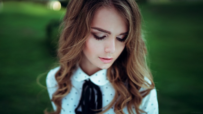 Portrait of a young woman with long brown hair